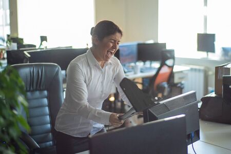 woman destroys a computer